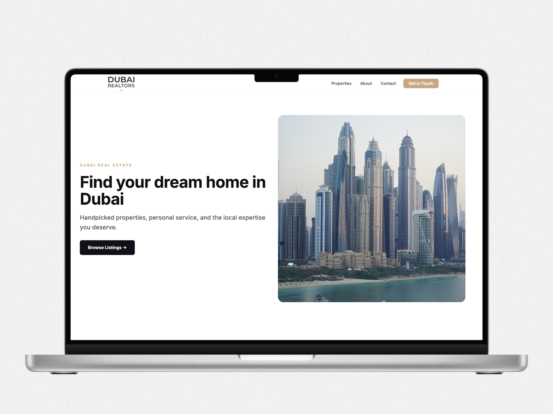 CrmJam agent website mockup on laptop — Dubai Realtors template with listings